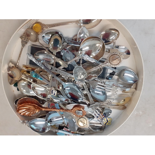 33 - Collectors teaspoons in four wall shelves to include a Rolex teaspoon and silver plated examples and... 