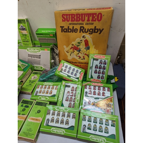 12 - A large collection of Subbuteo items to include teams, spectators, accessories, stands and other ite... 
