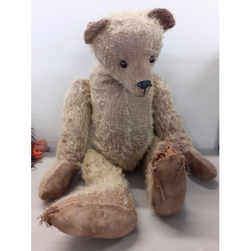 An early 20th century wood wool filled teddy bear with long nose, boot button eyes in the Steiff style A/F
Location: BWR