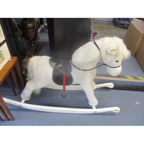 44 - A child's rocking horse with fitted saddle and reins, on white painted runners, Location: SR