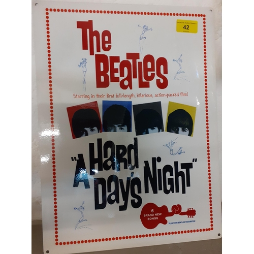 42 - A reproduction wall sign advertising The Beatles - A Hard Days Night film, 40 x 30cm, Location: BWR