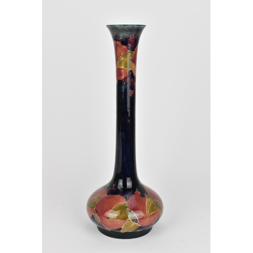 10 - An early 20th century William Moorcroft pottery vase in the 'pomegranate' pattern, shape no. 99, des... 