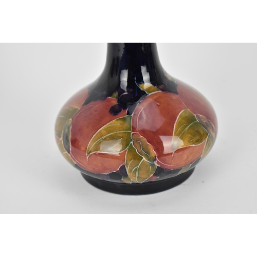 10 - An early 20th century William Moorcroft pottery vase in the 'pomegranate' pattern, shape no. 99, des... 