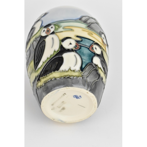 19 - A Moorcroft pottery 'Puffin' pattern baluster vase designed by Carol Lovett, 1997, with impressed ma... 