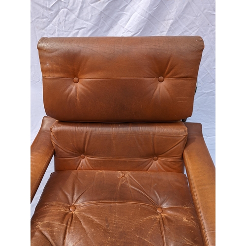 30 - A 1970s Tim Bates for Pieff tan leather and chrome Alpha lounge chair, with button back rest and sea... 