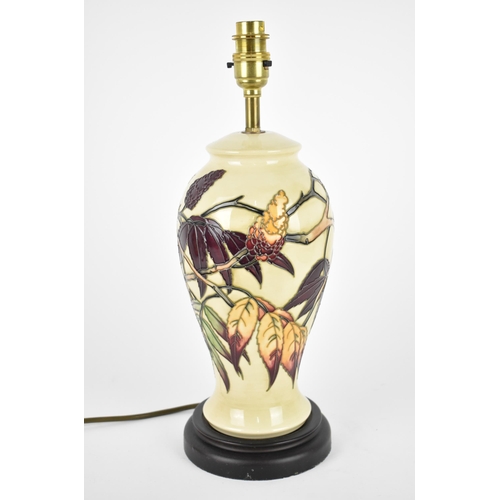 31 - A Moorcroft Pottery Sumac Tree pattern table lamp base designed by Phillip Gibson, the body decorate... 