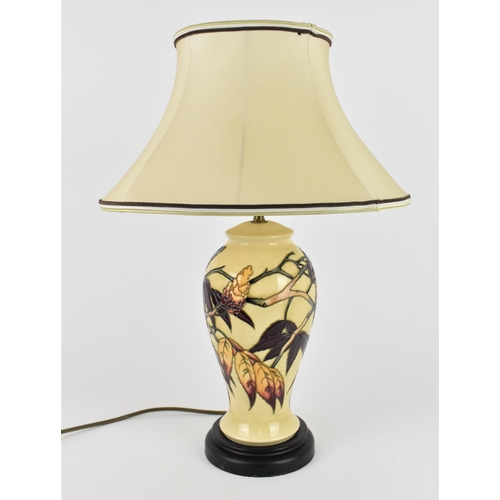 31 - A Moorcroft Pottery Sumac Tree pattern table lamp base designed by Phillip Gibson, the body decorate... 