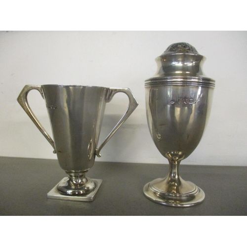 53 - Silver to include a twin handled cup and sugar caster, 171.6g
Location: 4.1