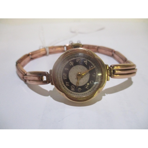 57 - An early 20th century ladies manual wind 9ct gold wristwatch on a 9ct gold expanding bracelet, 17.8g... 