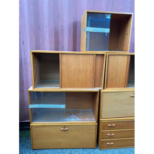 38 - A mid 20th century Ladderax style modular unit consisting of a three drawer chest, two fall down cup... 
