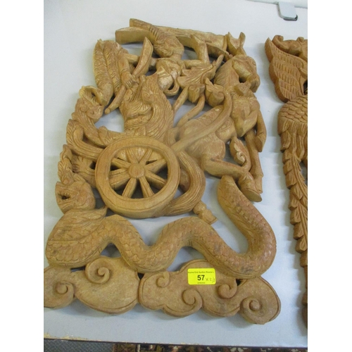 57 - A pair of teak carved Thai panels, one depicting a dragon and the other of a figure of a chariot, to... 