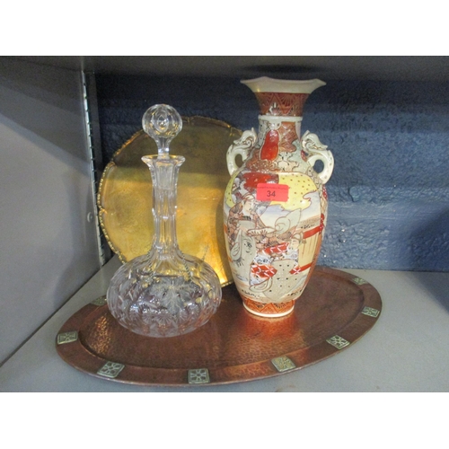 34 - A mixed lot to include an Arts & Crafts copper hammered tray and a decanter with a silver label in t... 