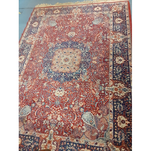 55 - A machine made and red ground rug, 250cm x 170cm, Location: G