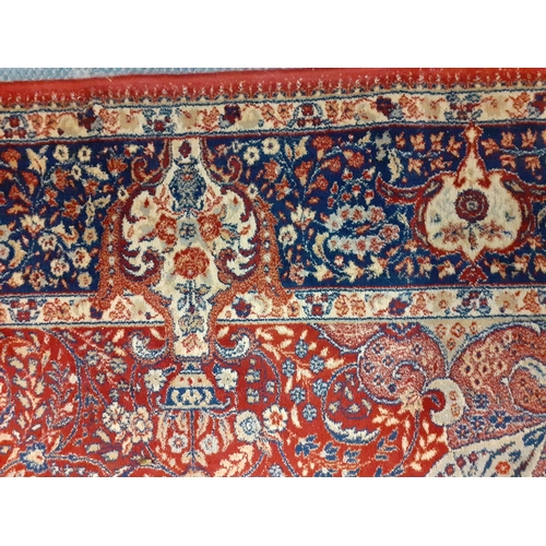 55 - A machine made and red ground rug, 250cm x 170cm, Location: G