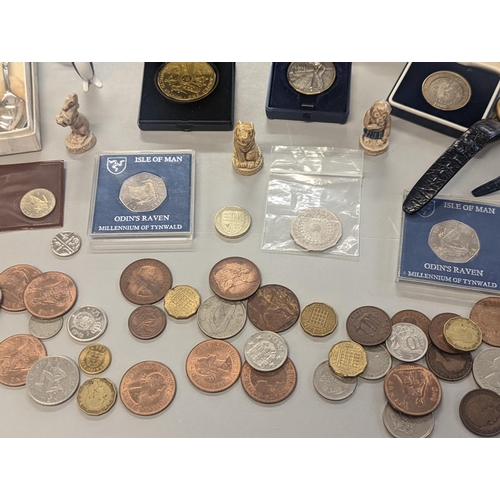24 - A mixed lot to include British and foreign coinage, commemorative Isle of Man coinage, and others, t... 