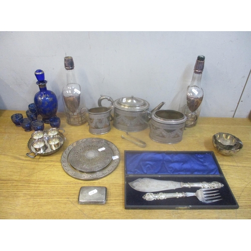 42 - A selection of silver, silver plate and glassware to include a silver cigarette case, a three piece ... 