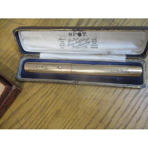 44 - A vintage Spot rolled gold fountain pen with 14ct gold nib, original box, a cased gilt metal and ena... 
