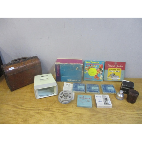 45 - A mixed lot to include a Huntley and Palmer's biscuit tin in the form of a briefcase, a Solar 3 slid... 