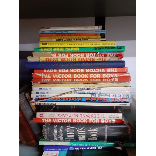 51 - A quantity of 20th Century books to include annuals and Ladybird books together with vintage Monopol... 