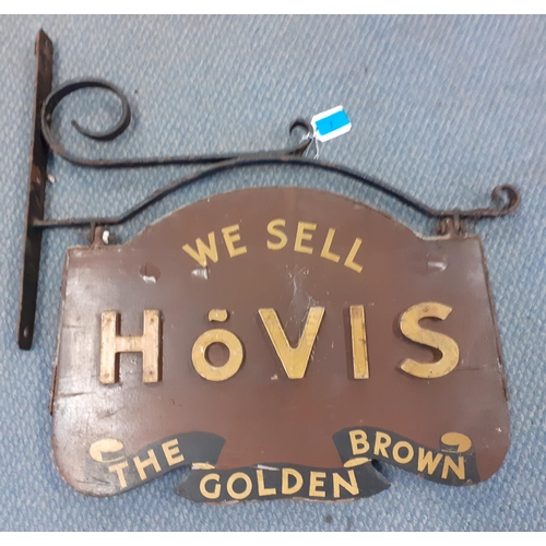 7 - A vintage wooden Hovis bread shop sign in a wrought iron frame together with a group of wrought iron... 