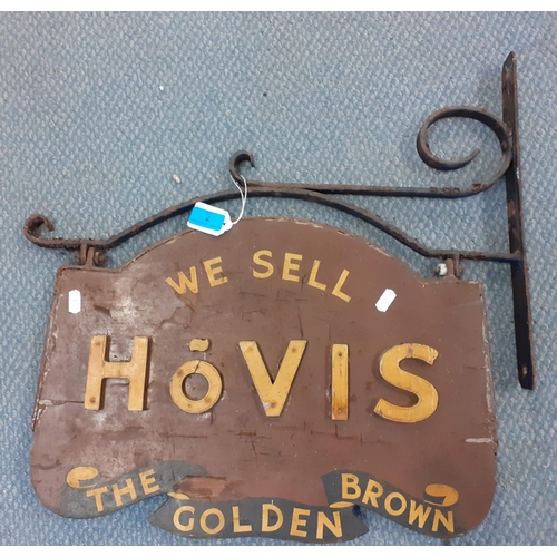 7 - A vintage wooden Hovis bread shop sign in a wrought iron frame together with a group of wrought iron... 