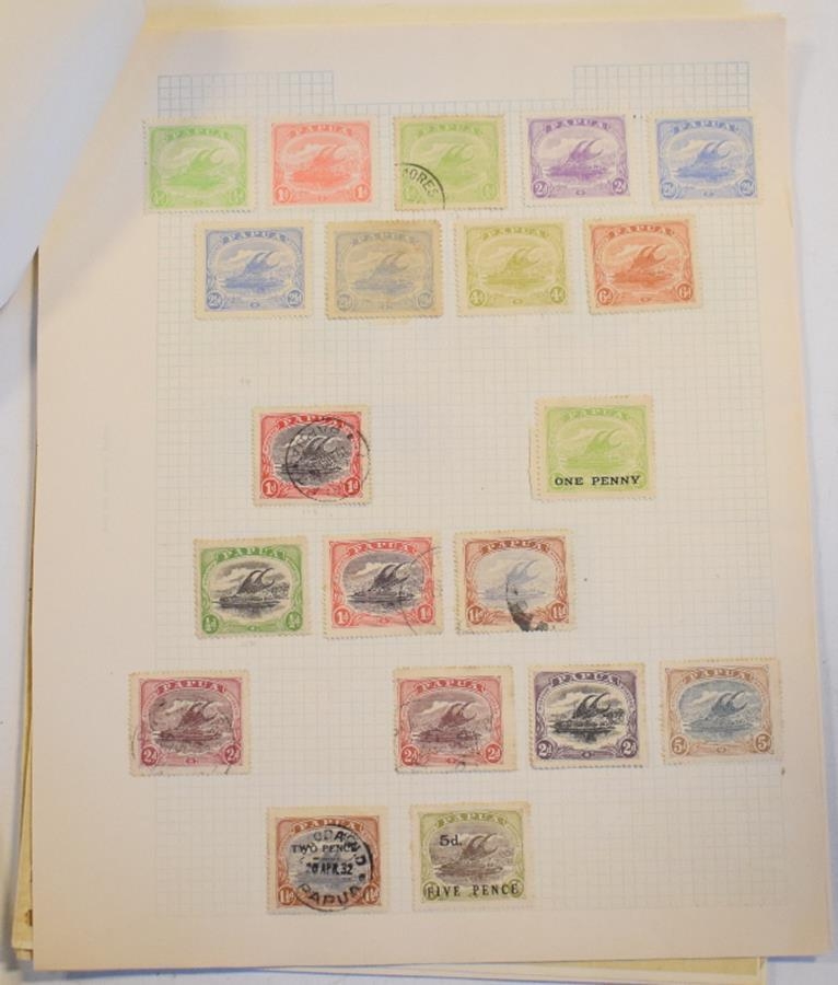 A group of Papua New Guinea stamps, an old collection on leaves with ...