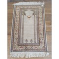 A Persian cream ground prayer mat, 136 cm x 93 cm