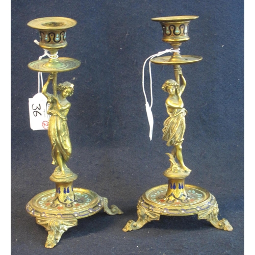36 - Pair of 19th Century yellow metal, possibly bronze figural classical design candlesticks with enamel... 