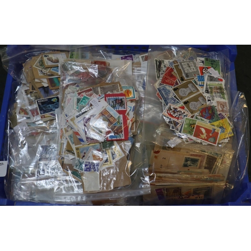 53 - Blue tray with all world selection of stamps in large quantity of plastic packets. 1000's of stamps.... 