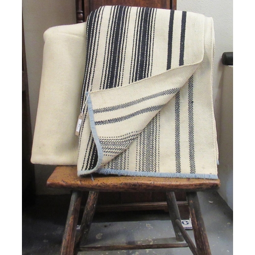 18 - Two antique narrow loom Welsh woollen blankets; one with black stripes of different width and the ot... 