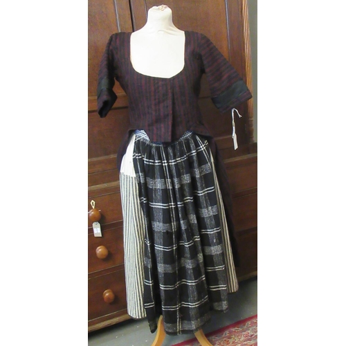31 - 19th Century traditional woollen Welsh costume to include; white and black striped skirt, a black an... 