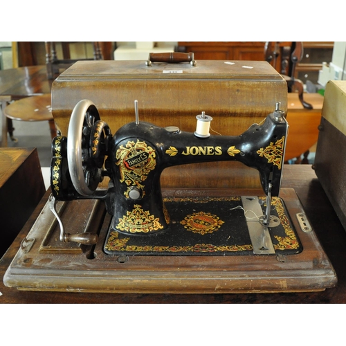 Vintage Jones sewing machine with fitted hood. (B.P. 21 + Barnebys