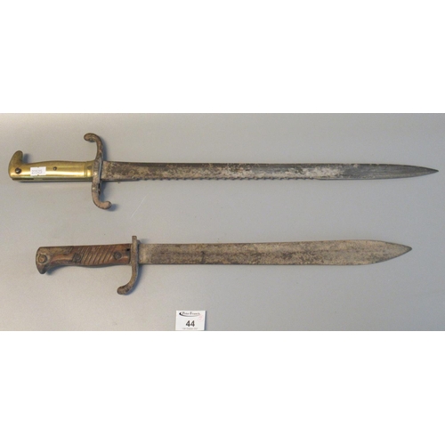 44 - British First World War period sword bayonet and another brass hilted saw backed bayonet. (2)
(B.P. ... 