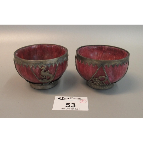 53 - A pair of oriental red stained hardstone white metal bound small bowls, 20th Century. (2)
(B.P. 21% ... 