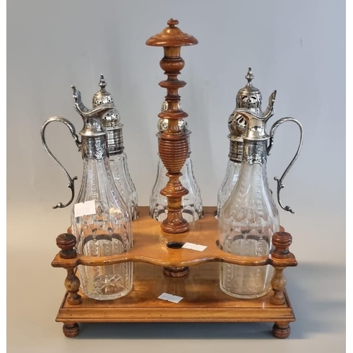 18 - Late 19th century five bottle cruet stand, the matching cut glass bottles all with unmarked white me... 