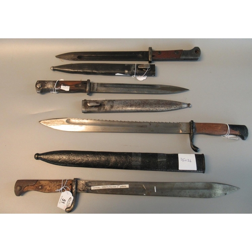 51 - A group of four bayonets to include; two similar German First World War period bayonets and scabbard... 