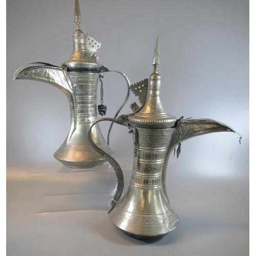 Two Omani type coffee pots/Dallahs. 26 & 36cm high approx. (2)
(B.P. 21% + VAT)