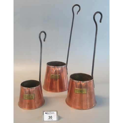 30 - Set of three copper and brass graduated cider measures. (3)
(B.P. 21% + VAT)