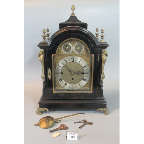 19th century three train ebonised bracket clock, the case with urn finials and term mounts, loop handles on scrolled feet. Arch brass face with silvered Roman chapter ring and strike silent and chime dials. Three train movement, striking on eight bells and a gong. 52cm high approximately.
(B.P. 21% + VAT)