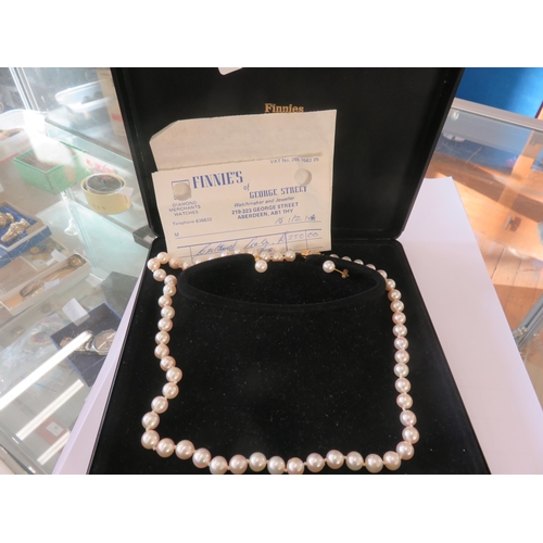 53 - String of Cultured Pearls and a Pair of Matching Earrings
