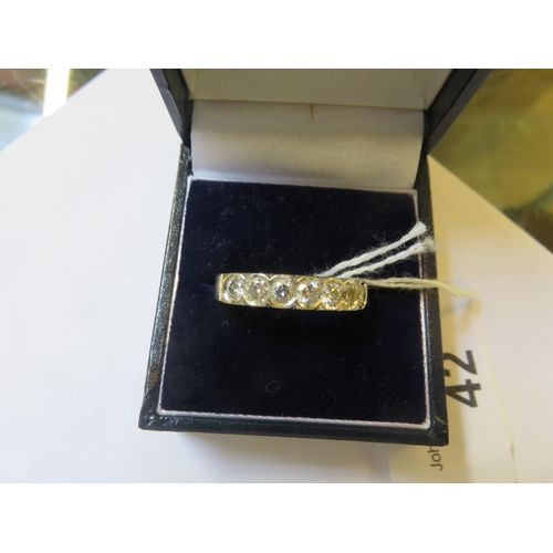 42 - 18ct Gold 7 Stone Straight Set Diamond Ring