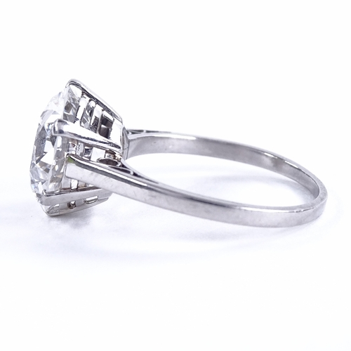 1101 - A 5.37ct solitaire diamond ring, the round brilliant-cut stone in plain 4-claw platinum setting, col... 