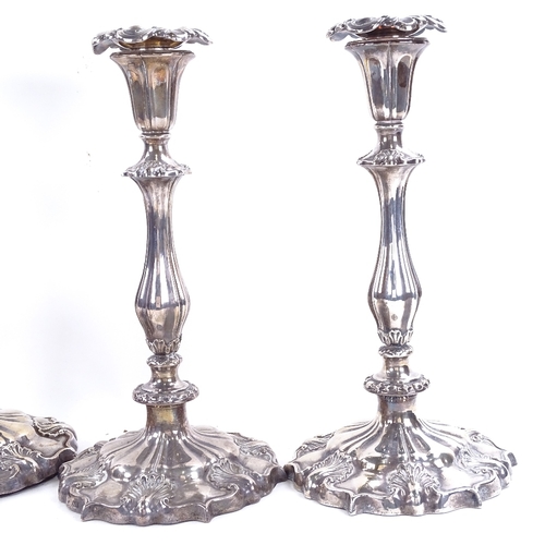 1633 - A set of 4 Victorian silver table candlesticks, shaped form with acanthus leaf decoration and remove... 