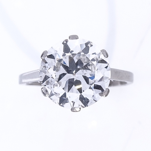 1101 - A 5.37ct solitaire diamond ring, the round brilliant-cut stone in plain 4-claw platinum setting, col... 