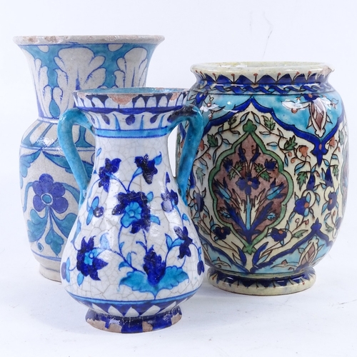 40 - 3 Iznik / Persian earthenware vases, tallest 18cm.