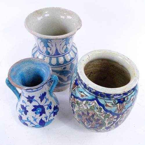 40 - 3 Iznik / Persian earthenware vases, tallest 18cm.