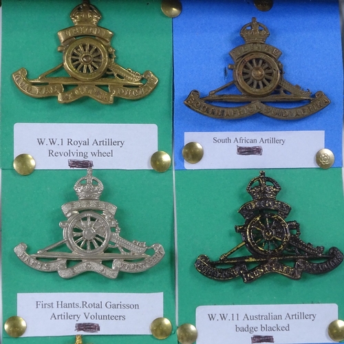 44 - A collection of 21 Royal Artillery cap badges.