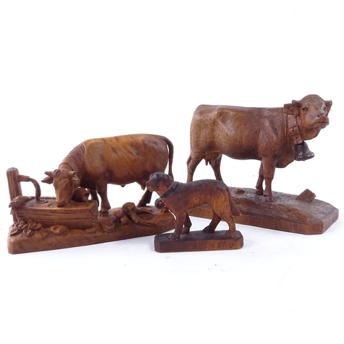 50 - 3 20th century Black Forest wood carvings, 2 bell cows and a St Bernard rescue dog, largest cow 9cm ... 