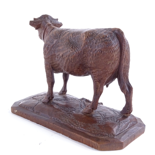 3 - Attributed to Johann Huggler, a finely carved Linden wood Black Forest bell cow, base length 13cm