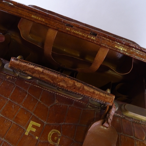 6 - A Victorian crocodile skin Gladstone bag, by Drew & Co, Leadenhall, London, with many original fitti... 